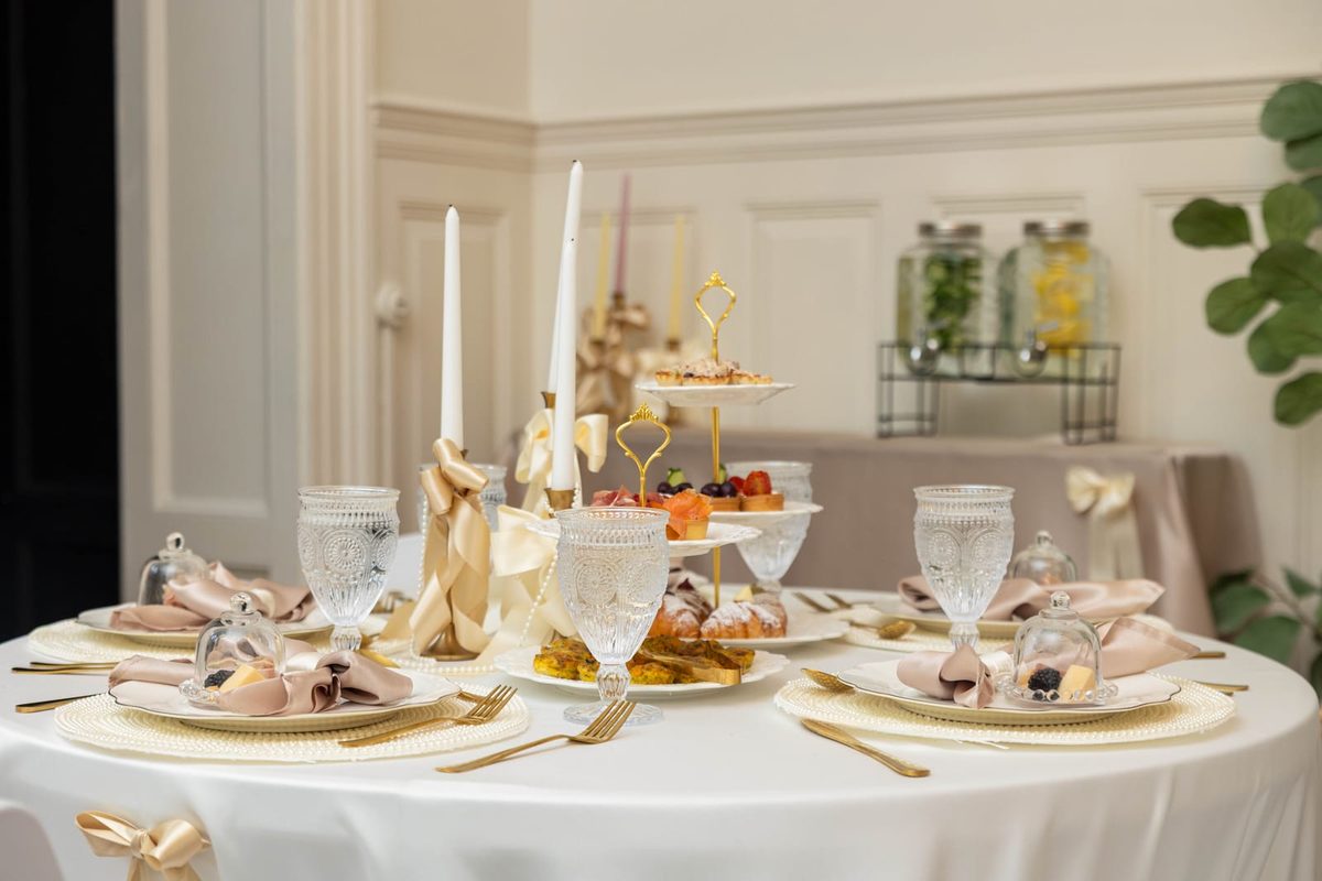 Pre-poured mimosa bar with four juice varieties at elegant baby shower