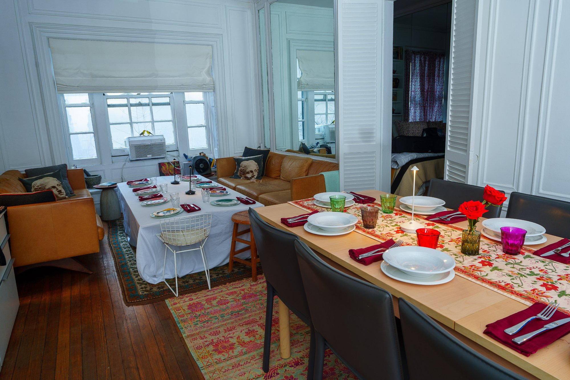 The same room extended for 16: a folding table added to run the full length of the apartment